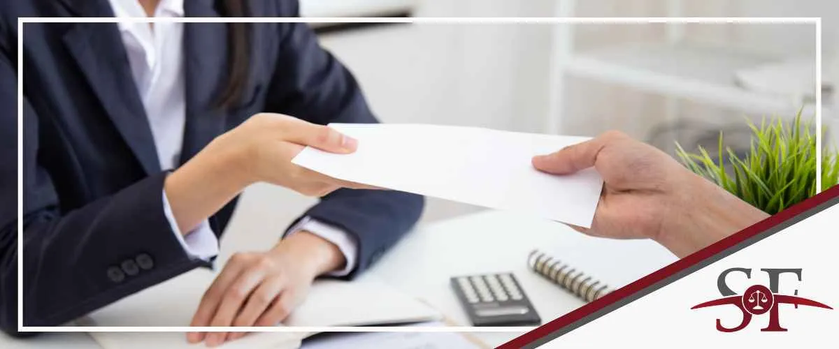 Legal assistant handing over a Florida workers' compensation filing.